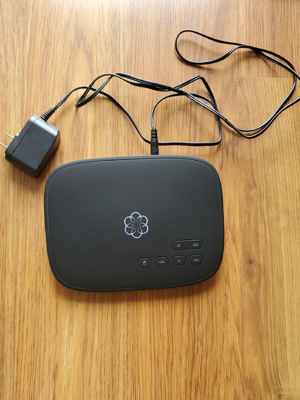 Ooma Telo VoIP Adapter with White Logo on Black Panel